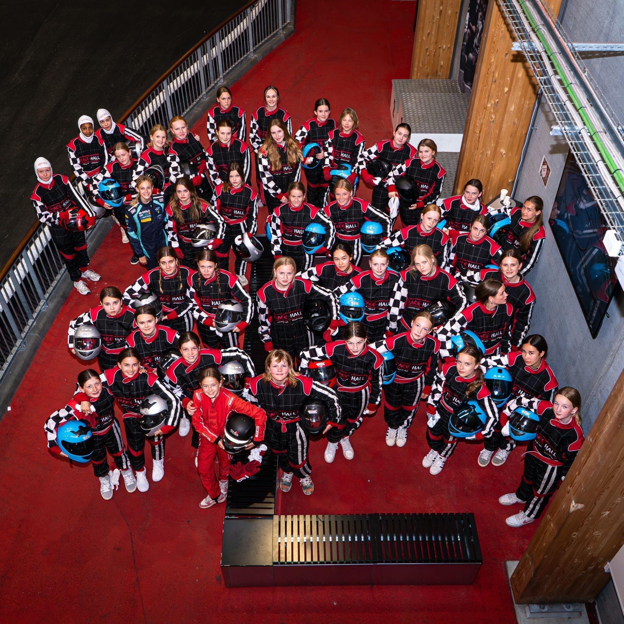 G.I.R.L. participants in racing suits at Racehall