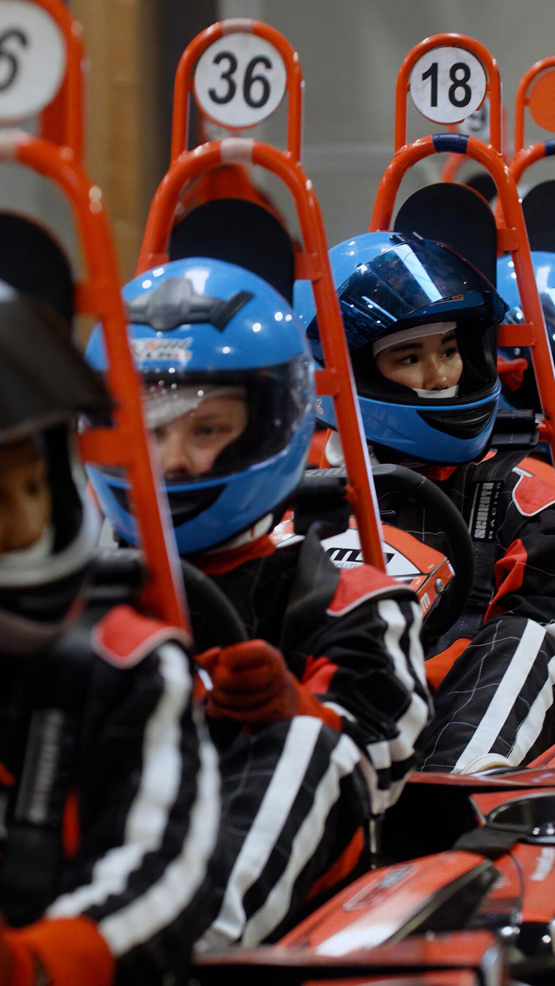 Girls wearing G.I.R.L. apparel on track